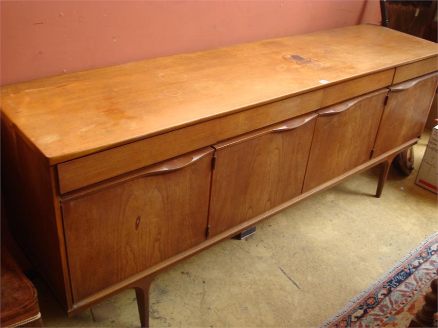 A Danish Austinsuite sideboard, with four drawers over four cupboards, 198 x 48 x 79cm high (stain