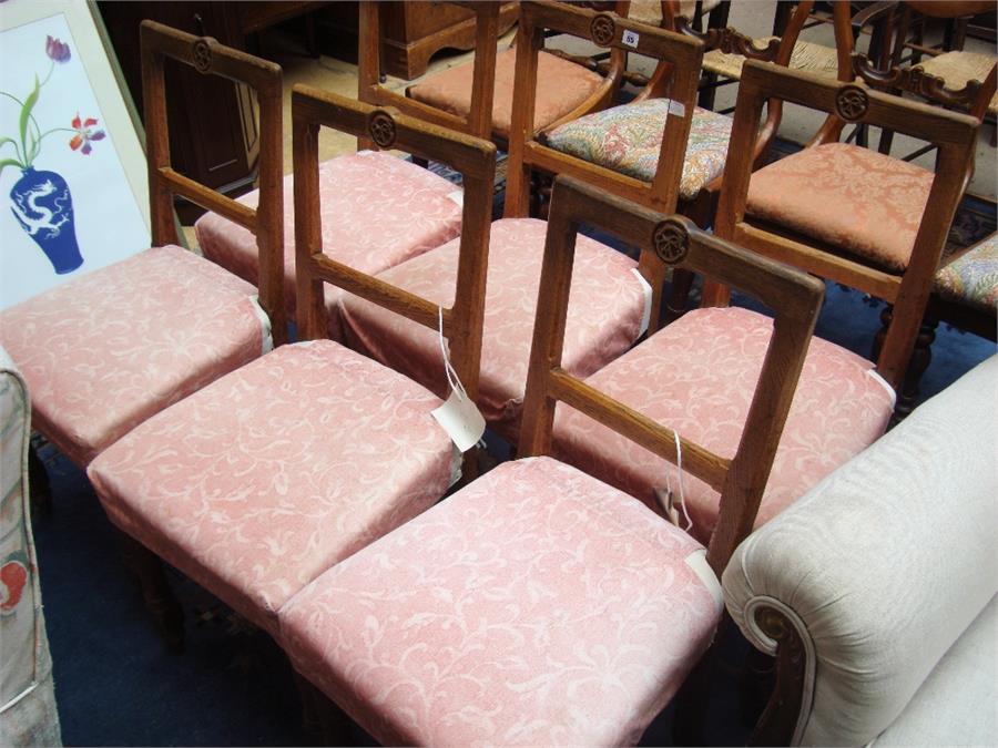 A set of six Victorian gothic revival oak dining chairs, in the manner of Augustus Pugin, each