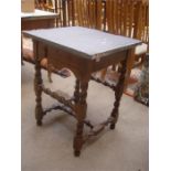 A 17th Century walnut table, with drawer (missing one handle) and with removable slate top.