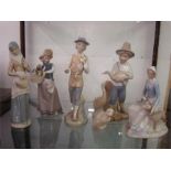 Lladro style porcelain figures.  A girl with dogs, a girl carrying a duck, a boy carrying a duck,