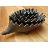 A Walter Bosse style nest of metal ashtrays in the form of a hedgehog.