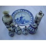 A lot comprising blue and white Delft, including a pair of small vases, a pair of lidded pots,