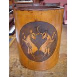 A tooled leather waste basket, decorated with two animals with interlocked horns, made by