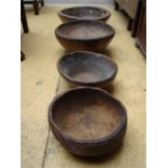 A set of four, poss African carved bowls.