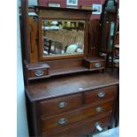 An Art Nouveau oak dressing chest.