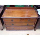 An Edwardian banded chest of drawers.