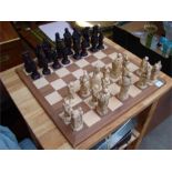 A Studio Anne Carlton French revolution chess set and board.