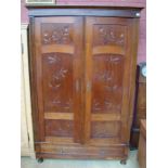 A rosewood double door wardrobe, one long drawer t