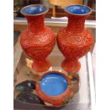 A pair of Chinese cinnabar lacquer vases, 20.5cm high together with a Chinese cinnabar ashtray (3).