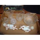 Two reclining German bisque piano babies together with a small quantity of clear glassware.