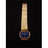 An 18ct gold ladies Rolex Orchid wristwatch, case measuring approx 23.3mm x 17.4mm, blue dial with