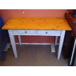 A two drawer painted pine table / desk.