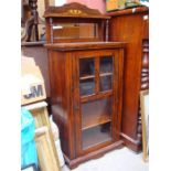 An Edwardian inlaid mirror back music cabinet, wit