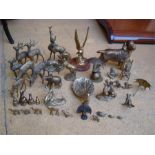 A selection of brass animal ornaments including frogs, birds, deer etc.