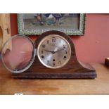An eight day mantle clock, with Arabic numerals, a
