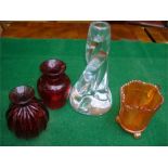 Four items of glassware to include a Sevres Art Glass swirl / wrythen candle holder, two small