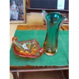 A Murano style vase in green, orange and clear glass together with an orange glass dish with