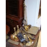 A box of mixed brass to include horse brasses, fire tools, candlesticks etc.
