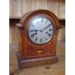 An eight day mantle clock, with Roman numerals and