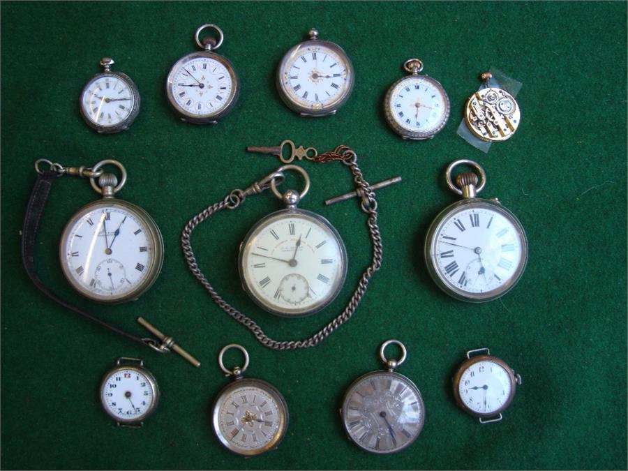 A selection of pocket watches, some silver.