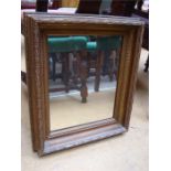 A gilt framed bevel edge mirror.