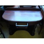 A Victorian mahogany demi-lune Duchess hall table,