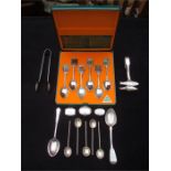 A small selection of silver, plate and white metal to incllude tongs and various other flatware.