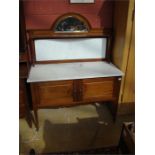 A 1920's mahogany marble top washstand with splash