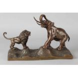 Bronze group of figures, ca. 1900. Elephant lion. (Somewhere on mounted) Dim. 21x31x12 cm. In good