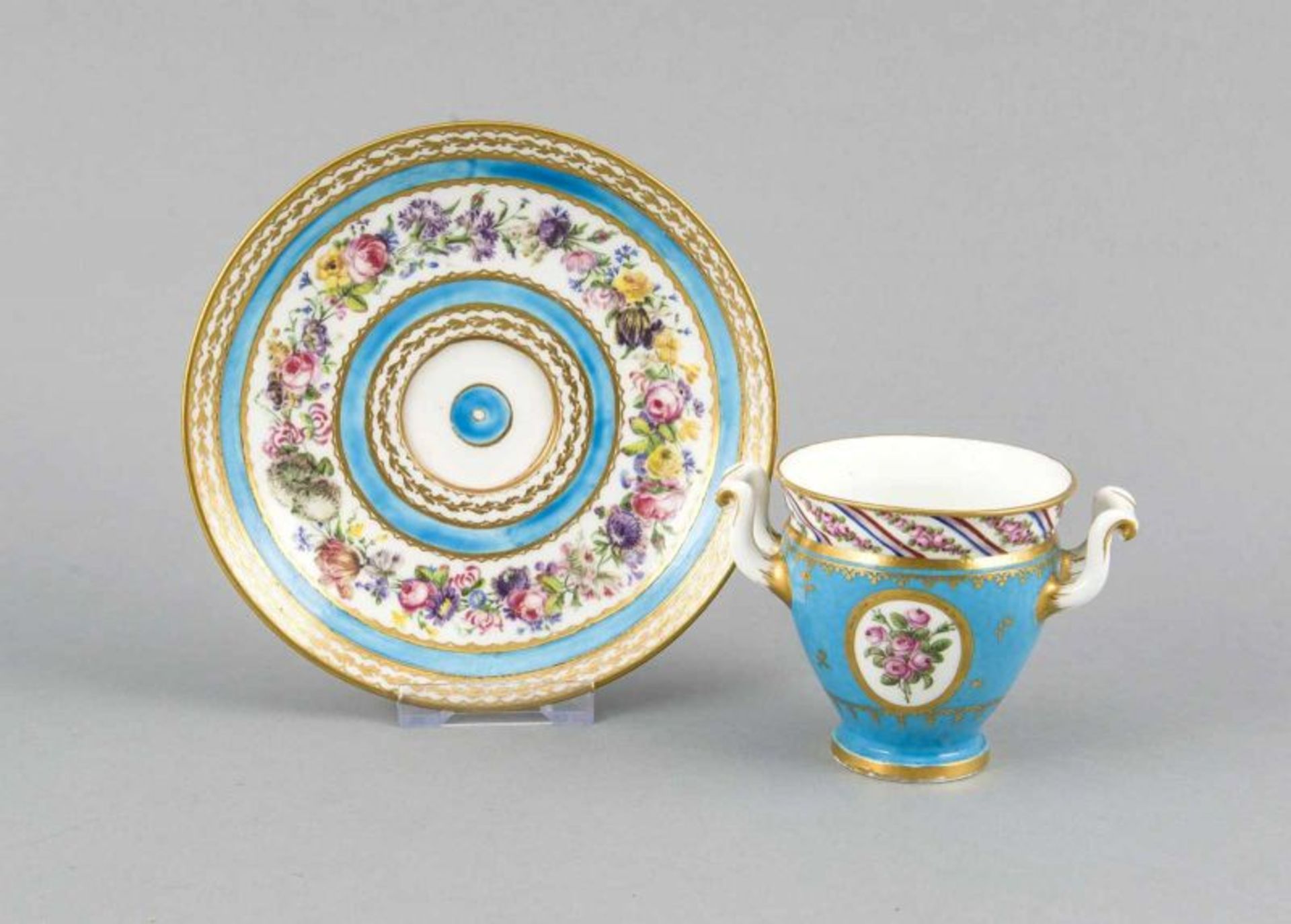 French 19th Century Sevres cup and saucer with floral and gold livery. Sevres, NN, DT. Dim. 10x16 cm