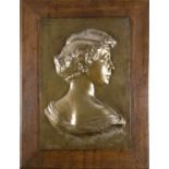 Large antique bronze plaque in oak table. Approx. 1900. 'Women's Bust', by Jean Herain 1907.