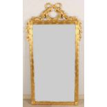 Gold-plated woodcut Louis Seize-style mirror with antique mirror glass. List likely 20th century.