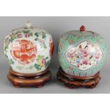 Two large old / antique chinese porcelain ginger pots with floral and figure decors. On wooded