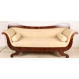 Early 19th century big mahogany empire bench with beautiful cream-colored upholstery and copper