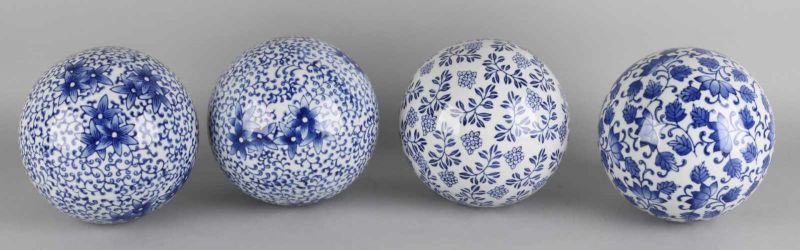 Four old Chinese porcelain balls with floral decors. 20th century. Size: approx. 17 cm. In good