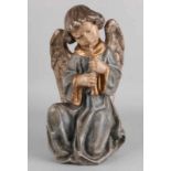 Italian, partially gold-plated wood-engraved angel. Second half 20th century. With polychromia.