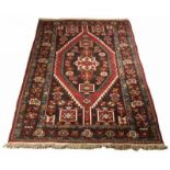 Old Persian garment with floral decors, in earth tones. Dimensions: 124 x 196 cm. In good