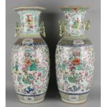 Two large Chinese porcelain Family Pink vases with enamel figures and floral decors. (One ear piece