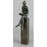 Bronze figure on marble shelf. Second half 20th century. Reading woman. (Piece of marble).