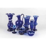 Nine pieces of blue glass, 19th-20th century. (White border). Consisting of: One bowl, five vases,