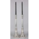 Two large modern plated candle holders. Size: 44 cm. In good condition.