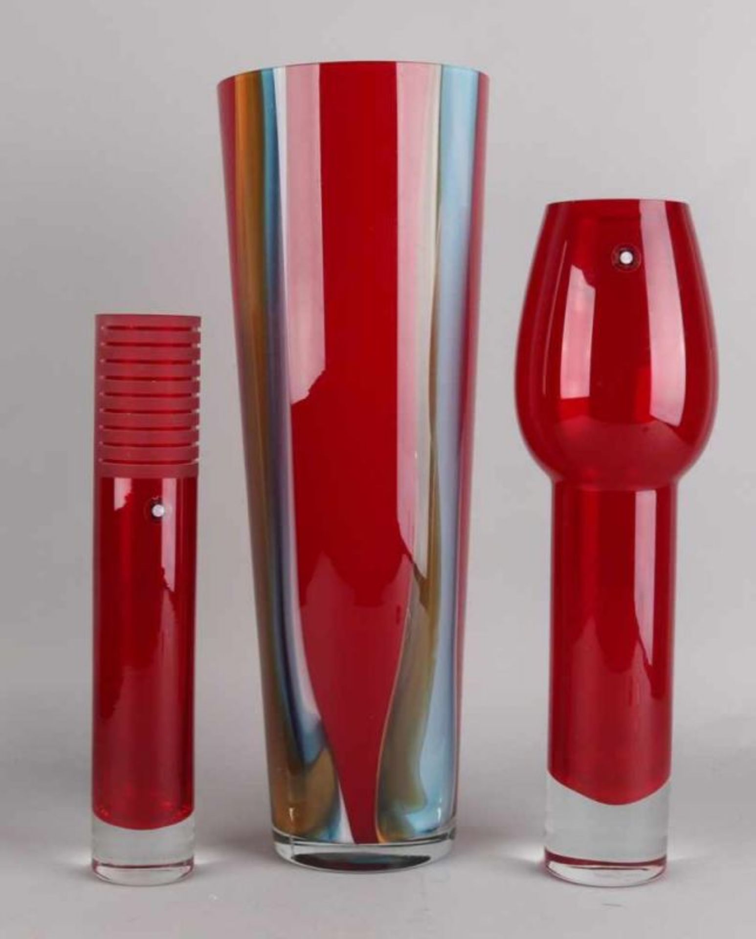 Three large modern artificial glass vases, red. One-time tulip form Tarnowiec. One-time Powdered