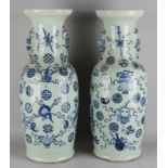 Two large chinese porcelain vases with green celadon glaze with symbols decors. 19th century.