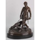 Large bronze figure on black marble basement. 21st century. Signed PJ Mené. Hunter with hunting