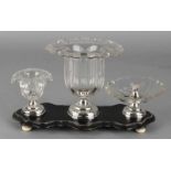 Cut crystalline table sets, partly with folded edges with almond trim on floral engraved silver