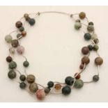 Necklace with agate agate, 8-13 mm, ironed with silver, 835/000, wavy tube elements. 3 row. Length