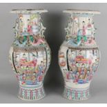 Two large chinese porcelain vases with floral and figurines and gold decors. 19th century.