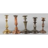 Various 18th-19th century candlesticks. Two pieces of tin, three pieces of brass. Height: 18-23 cm.