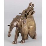 Oriental bronze figure. Indian elephant with royal figures. 20th century. Dimension: 13 cm. In good