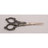 Silver scissors, 835/000 Art Nouveau, decorated with stripes and pearl rims. About 72 gr. 5,5x15 cm